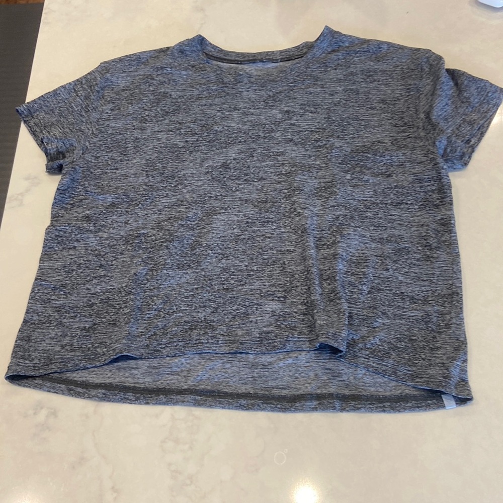 Size 6 Lululemon athletic t-shirt. Barely worn!